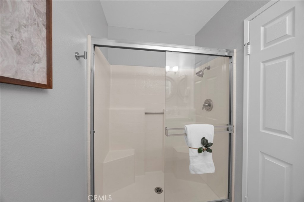 Primary bedroom at 3675 Cypress Ln with neutral walls, soft natural light, and an ensuite full bath