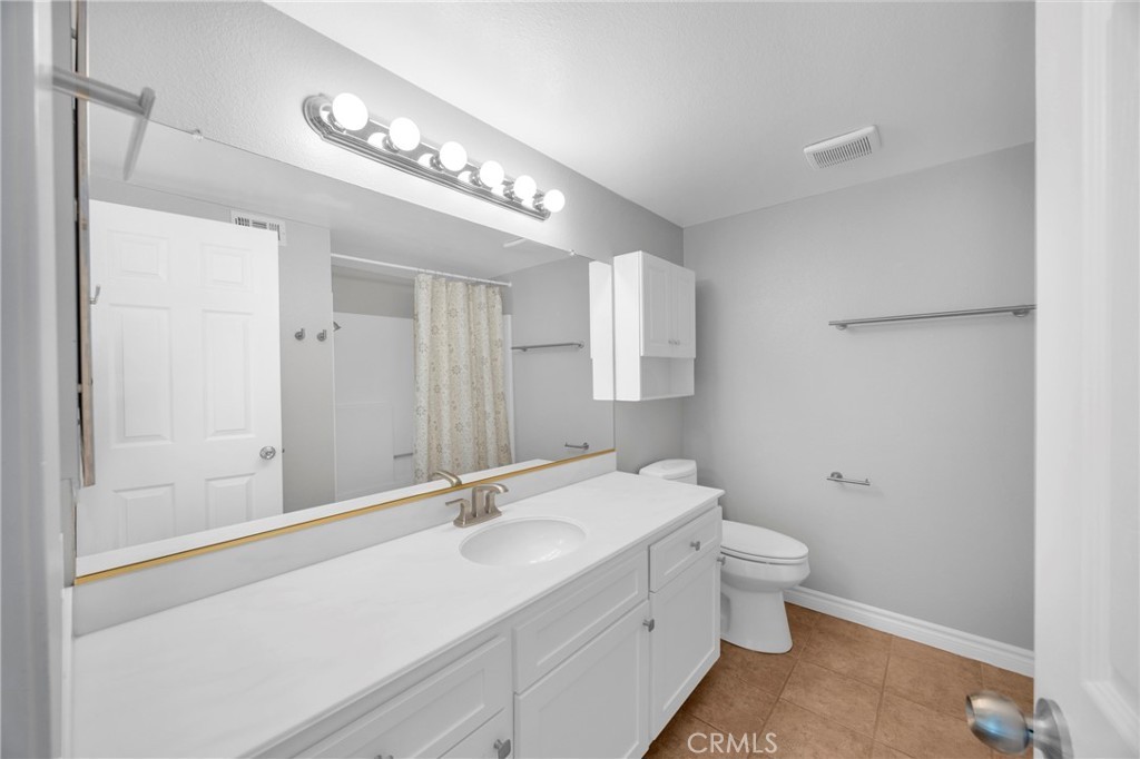 Updated full bathroom at 3675 Cypress Ln with a walk-in shower and clean modern fixtures